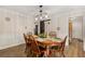 Elegant dining room with wood floors and a rustic barn door feature at 1027 Spring Mill Sw Dr, Lilburn, GA 30047