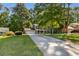Attractive two-story home with well-manicured lawn, attached garage, and a welcoming front porch at 1027 Spring Mill Sw Dr, Lilburn, GA 30047