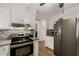 Updated kitchen featuring stainless steel appliances and plenty of cabinet space at 1027 Spring Mill Sw Dr, Lilburn, GA 30047