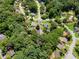 Scenic aerial view of a neighborhood surrounded by lush greenery and well-maintained homes at 1275 Muirforest Way, Stone Mountain, GA 30088