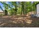 This spacious backyard provides ample space for outdoor activities and relaxation, featuring a deck at 1275 Muirforest Way, Stone Mountain, GA 30088