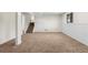 Unwind in this finished basement with neutral carpet and crisp white walls, creating an inviting and relaxing atmosphere at 1275 Muirforest Way, Stone Mountain, GA 30088