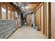 Unfinished basement with block walls, exposed ducts and a water heater offers potential for customization at 1275 Muirforest Way, Stone Mountain, GA 30088