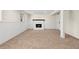 Finished basement offers a cozy fireplace, neutral carpet, and crisp white walls with charming wainscoting detail at 1275 Muirforest Way, Stone Mountain, GA 30088
