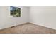 Bedroom features carpeted floor, neutral walls and trim and large window at 1275 Muirforest Way, Stone Mountain, GA 30088