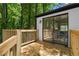 Enjoy outdoor living on this wooden deck with sliding door to the house, perfect for entertaining or relaxing at 1275 Muirforest Way, Stone Mountain, GA 30088