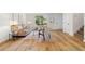Inviting living space with hardwood flooring, neutral colors, and a glimpse of the staircase at 1275 Muirforest Way, Stone Mountain, GA 30088