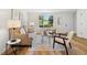 Cozy living room with hardwood floors, neutral paint, and stylish furniture at 1275 Muirforest Way, Stone Mountain, GA 30088