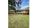 Charming single-story brick home with a well-manicured lawn and mature trees at 1838 Cates Ct, Snellville, GA 30078