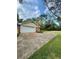 Exterior shot of garage, wide driveway, and well-kept lawn at 1838 Cates Ct, Snellville, GA 30078
