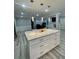 Modern kitchen island with white cabinets, quartz countertop, and stylish pendant lighting at 1838 Cates Ct, Snellville, GA 30078