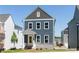 Charming two-story home with blue siding, a yellow door, and a welcoming front porch at 2729 Creek View Nw Ter, Atlanta, GA 30318