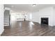 Open-concept living space featuring a cozy fireplace and modern kitchen area at 2729 Creek View Nw Ter, Atlanta, GA 30318