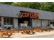 Exterior shot of Scofflaw Brewing Co featuring its beer garden, industrial design and string lights at 2729 Creek View Nw Ter, Atlanta, GA 30318