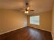 Large bedroom featuring a ceiling fan, window, and hardwood floors at 3836 Wexford Dr, Douglasville, GA 30134