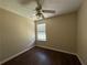 Comfortable bedroom with a ceiling fan, window, and hardwood floors at 3836 Wexford Dr, Douglasville, GA 30134