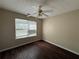 Comfortable bedroom with a ceiling fan, window, and hardwood floors at 3836 Wexford Dr, Douglasville, GA 30134