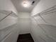 Walk-in closet with wire shelving and hardwood floors at 3836 Wexford Dr, Douglasville, GA 30134