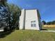 Exterior view displaying vinyl siding, a chimney, a window, and surrounding greenery at 3836 Wexford Dr, Douglasville, GA 30134