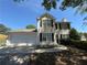 Charming two-story home with a well-maintained lawn, two-car garage, and mature landscaping at 3836 Wexford Dr, Douglasville, GA 30134