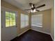 Cozy sun room with abundant natural light from windows and a door to the yard at 3836 Wexford Dr, Douglasville, GA 30134