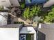 Overhead view of the modern home with patio area featuring gravel, bluestone, trees and outdoor seating at 53 Daniel Se St, Atlanta, GA 30312