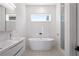 Luxurious bathroom featuring a soaking tub, sleek vanity, and modern fixtures, perfect for relaxation and pampering at 53 Daniel Se St, Atlanta, GA 30312