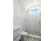Modern bathroom featuring a glass-enclosed shower with white subway tile and patterned floor tile, offering a sleek design at 53 Daniel Se St, Atlanta, GA 30312