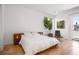 Bright bedroom with a large bed, modern furnishings, and access to a balcony, creating a comfortable and stylish space at 53 Daniel Se St, Atlanta, GA 30312