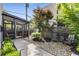 Courtyard area with a screened-in porch, landscaping, gravel, bluestone, and comfortable seating at 53 Daniel Se St, Atlanta, GA 30312