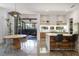 Open-plan dining area with a modern kitchen, and access to an outdoor patio at 53 Daniel Se St, Atlanta, GA 30312