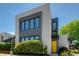 Modern two-story home featuring large windows, and a bright yellow front door at 53 Daniel Se St, Atlanta, GA 30312