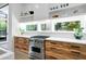 Stylish kitchen featuring a stainless steel range, wooden cabinets, and open shelving at 53 Daniel Se St, Atlanta, GA 30312
