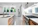 Modern kitchen with stainless steel appliances, white countertops, and wood grain cabinets at 53 Daniel Se St, Atlanta, GA 30312