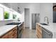 Modern kitchen with stainless steel appliances, wooden cabinets, and white countertops at 53 Daniel Se St, Atlanta, GA 30312