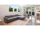 Open living room featuring a sectional couch, polished concrete floors, and sliding patio doors at 53 Daniel Se St, Atlanta, GA 30312