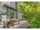 Charming outdoor patio with a wooden dining table, gravel and luscious green landscaping at 53 Daniel Se St, Atlanta, GA 30312
