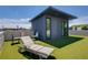 Relaxing roof deck featuring artificial turf, lounge chairs, and a modern building with windows and a door at 53 Daniel Se St, Atlanta, GA 30312