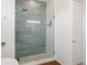 Elegant bathroom showcasing a glass-enclosed shower with gray tile and modern fixtures, offering a spa-like experience at 53 Daniel Se St, Atlanta, GA 30312