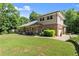 Beautiful backyard with lush lawn, patio, and brick home at 5816 Chamblee Dunwoody Rd, Atlanta, GA 30338
