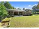 Spacious backyard with brick home and covered patio, perfect for outdoor entertaining at 5816 Chamblee Dunwoody Rd, Atlanta, GA 30338