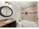 Elegant bathroom with decorative tile, a vanity with granite counters, and a shower-tub combination at 5816 Chamblee Dunwoody Rd, Atlanta, GA 30338