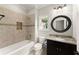 Charming bathroom featuring a shower-tub combination and granite vanity at 5816 Chamblee Dunwoody Rd, Atlanta, GA 30338