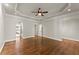 Spacious primary bedroom with hardwood floors, recessed lighting, and neutral paint at 5816 Chamblee Dunwoody Rd, Atlanta, GA 30338