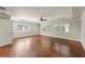 This spacious bedroom has hardwood floors, a ceiling fan, and lots of natural light at 5816 Chamblee Dunwoody Rd, Atlanta, GA 30338