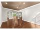 Elegant dining room with hardwood floors and view of living area at 5816 Chamblee Dunwoody Rd, Atlanta, GA 30338