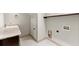 Bright laundry room with granite countertop, sink and tile flooring at 5816 Chamblee Dunwoody Rd, Atlanta, GA 30338