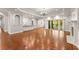 Spacious living area with hardwood floors, fireplace, and access to outdoor space at 5816 Chamblee Dunwoody Rd, Atlanta, GA 30338