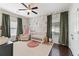 Charming Bedroom with a floral accent wall, plush rug, and modern crib at 1338 Dupont Nw Park, Atlanta, GA 30318