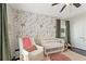 Inviting Bedroom with rocking chair, soft rug, floral wallpaper, and modern crib at 1338 Dupont Nw Park, Atlanta, GA 30318